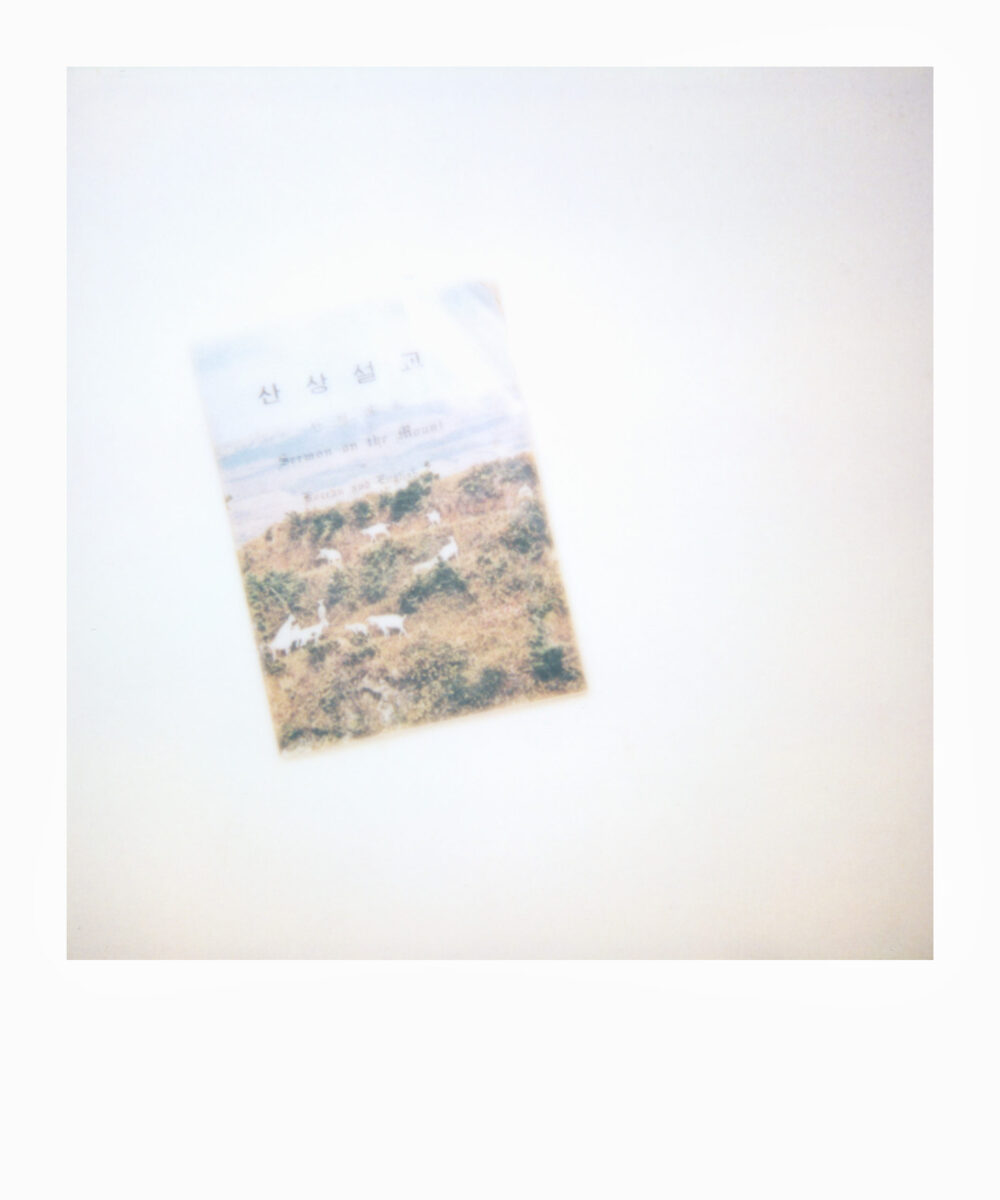 oversized Polaroid of a religious booklet