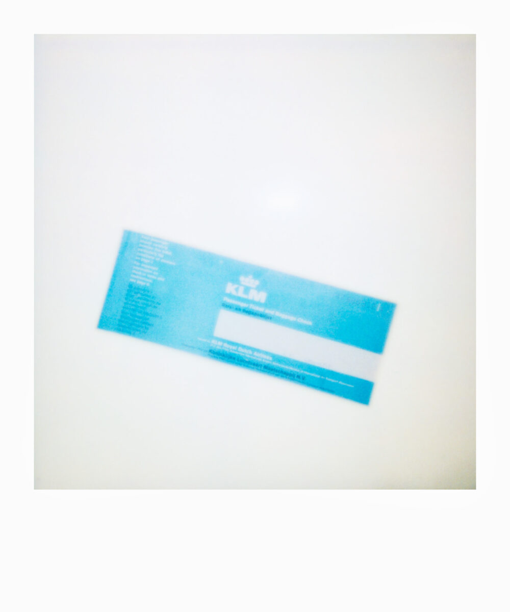 oversized Polaroid of a KLM plane ticket